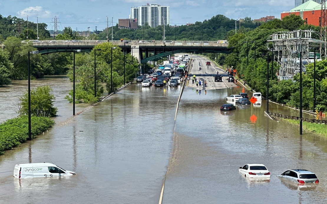 TORONTO LASHED BY HEAVY RAINS, CAUSING POWER OUTAGES AND FLOODING