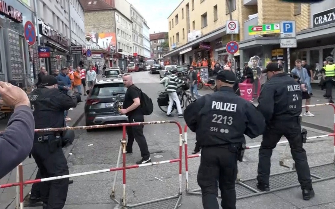 HAMBURG POLICE SHOOT MAN WITH ROOFER’S HAMMER DURING FOOTBALL FANS’ MARCH